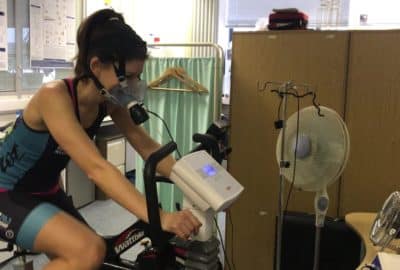Kirsty on an exercise bike, being monitored.