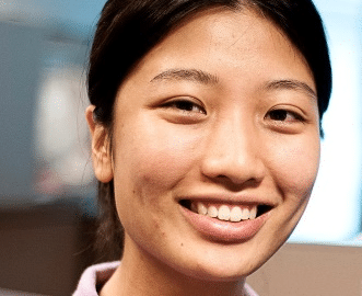 East Asian woman smiling